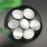Ove shape selenite palm stone