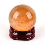 Orange selenite sphere