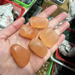 Orange selenite tumbled stone