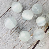 Magical selenite tumbled spheres