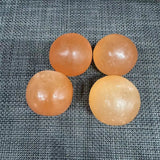 Orange selenite sphere