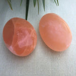 Red selenite palm stone