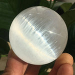 Selenite sphere with holder