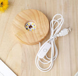mage of the wooden base of the lamp, LED bulb and a USB connection.