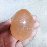 Orange selenite palmstone