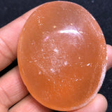 Orange selenite palmstone healing
